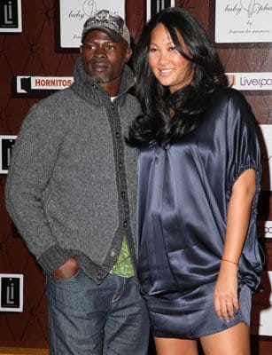 Djimon Hounsou and a pregnant Kimora Lee Simmons at clothing launch in Mexico City