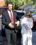 Fergie and Josh Duhamel with their son Axl at his baptism