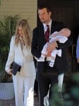 Fergie and Josh Duhamel with their son Axl at his baptism