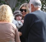 Fergie outside Super Bowl party with son AXL