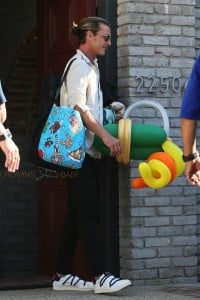 Gavin Rossdale carries the bags after Joel Silver's Memorial Day Party