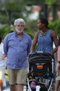 George Lucas and his wife Mellody Hobson with their daughter Everest  stroll in St