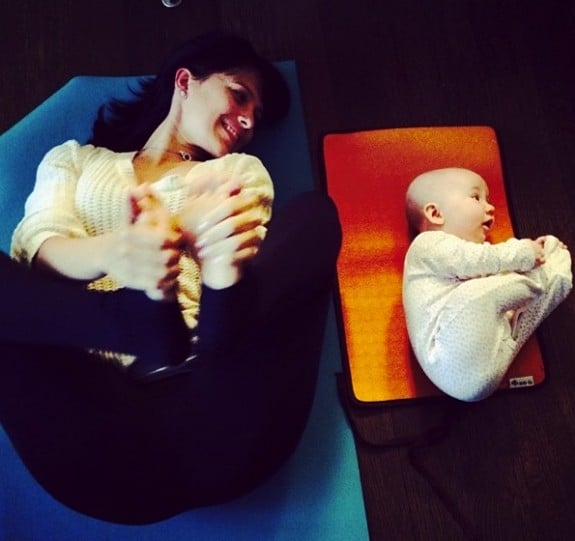 Hilaria and Carmen Baldwin practice yoga