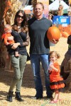 Ian and Erin Ziering visit the pumpkin patch with their daughter Mia and Penna