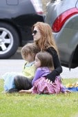 Isla Fisher attends a birthday party with daughters, Olive Cohen and Elula Lottie Miriam Cohen, at The Coldwater Park in Beverly Hills