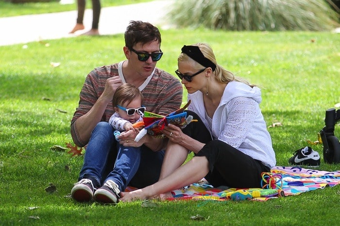 Jaime King and Kyle Newman out at the park with son James