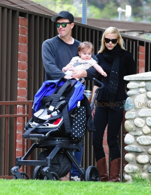 Jaime King and husband Kyle Newman with son James at the park