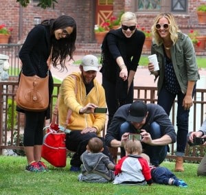 Jamie King and Jordana Brewster with their kids James and Julian at the park