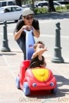 **EXCLUSIVE**Jillian Michaels chases her daughter Lukensia with son Phoenix in a toy car in Malibu