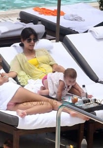 Kardashian with daughter Penelope pool side in Miami