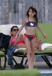Katie Holmes and daughter Suri Cruise by the pool in Miami