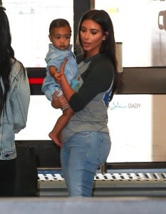 Kim Kardashian with daughter North West go through security at Burbank airport