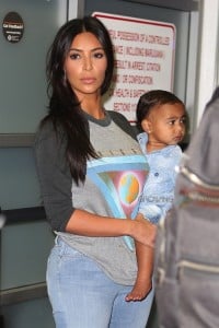 Kim Kardashian with daughter North West go through security at Burbank airport CA
