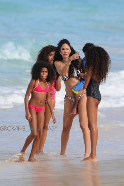 Kimora Lee Simmons plays in the ocean in St. Barts with kids Kenzo, Ming and Aoki