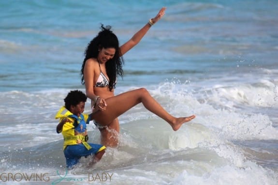 Kimora Lee Simmons plays in the ocean in St. Barts with son Kenzo
