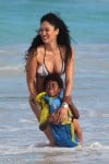 Kimora Lee Simmons plays in the ocean in St