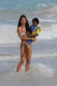 Kimora Lee Simmons plays in the ocean with son Kenzo