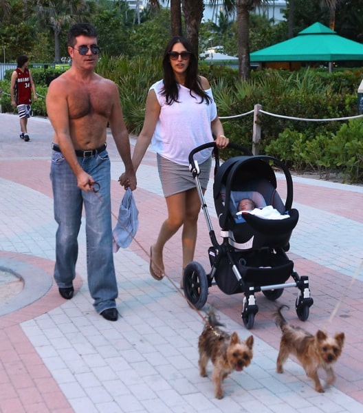 Lauren Silverman and Simon Cowell stroll with their son Eric