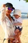 Lauren Silverman strolls on the beach in Barbados with son Eric