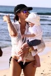 Lauren Silverman strolls on the beach in Barbados with son Eric