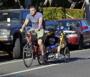 Liev Schreiber and Naomi Watts bike to the beach with their boys