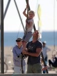 Liev Schreiber climbs the rope a the park with his son Sasha