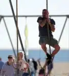 Liev Schreiber climbs the rope a the park with his son Sasha