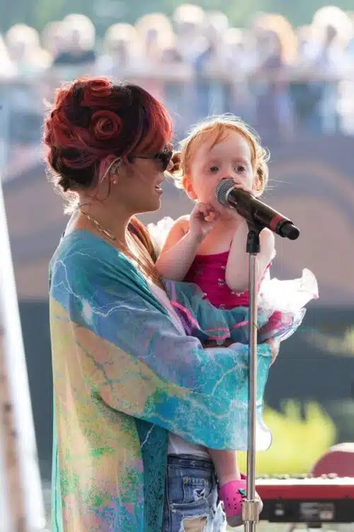 Lily Allen with her daughter Marni rehearsing for Latitude Festival