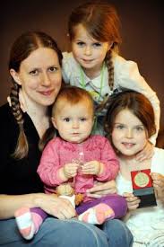 Lucy Deakin with baby Eliza and her sisters Megan and Freya