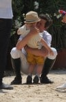 Marion Cotillard with Guillaume Canet and son Marcel at Cannes during the International show jumping
