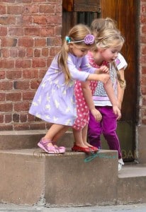 Marion & Tabitha Broderick play on the way home from school