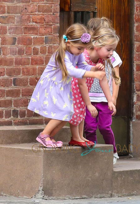 Marion & Tabitha Broderick play on the way home from school