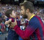 Shakira and baby son cheer on dad