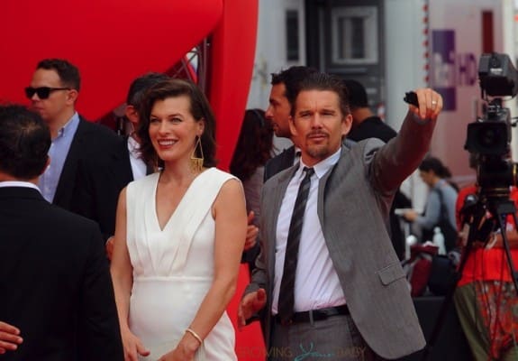 Milla Jovovich shows off her growing baby belly @ the premiere of Cymbeline