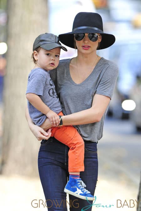 Miranda Kerr carries a very happy looking Flynn Bloom as they head home after a stroll through Central Park in New York