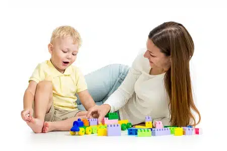 Mom and toddler playing blocks