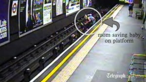 Mom saves baby on tracks after Baby's carriage blows off platform