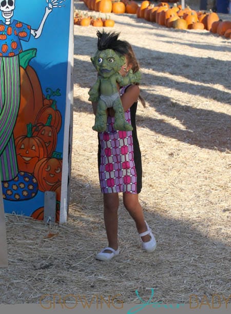 Nahla Aubry carries a martian as she leaves  at Mr. Bones Pumpkin Patch