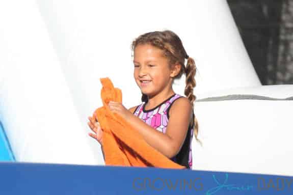 Nahla Audrey slides down the skeleton slide  at Mr. Bones Pumpkin Patch