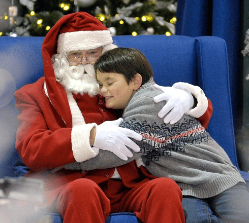 Nine-year-old Gabe Champage visits with Santa at Square One in Mississauga