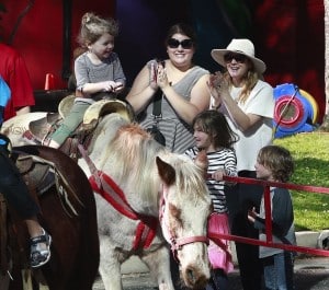 Olive Kopeman rides as horse at the market