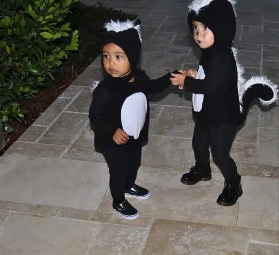Penelope Disick and North West dressed as a skunks for Halloween