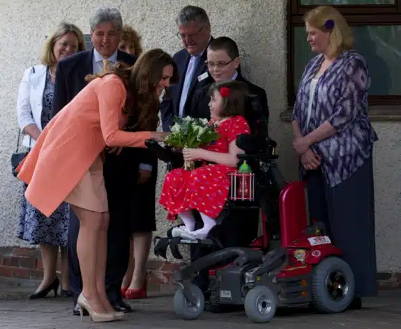 Pregnant Duchess of Cambridge receives flowers from Sally Evans at Naomi House