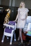 Pregnant Jaime King glowed as she showed off her favorite new baby gifts, including the Nuna ZAAZ highchair, during her baby shower on August 17, 2013