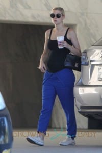 Jaime King shows off her growing baby bump in a black tank top as she makes a stop at a Coffee Bean in Los Angeles