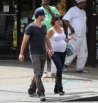 Jennifer Love Hewitt shows off her expanding baby bump as she and fiance Brian Hallisay take a stroll around New York City