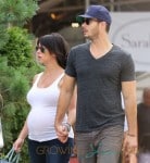 Jennifer Love Hewitt shows off her expanding baby bump as she and fiance Brian Hallisay take a stroll around New York City