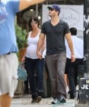 Jennifer Love Hewitt shows off her expanding baby bump as she and fiance Brian Hallisay take a stroll around New York City