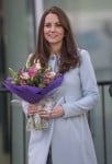 A pregnant Catherine, The Duchess of Cambridge, departs after visiting the Kensington Aldridge Academy in London