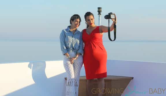 Kim Kardashian shows off her bump in tight red dress on board a yacht with Kourtney Kardashian in Greece